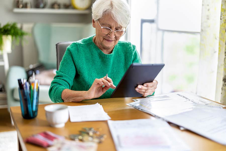 Woman on iPad for Medicare Enrollment